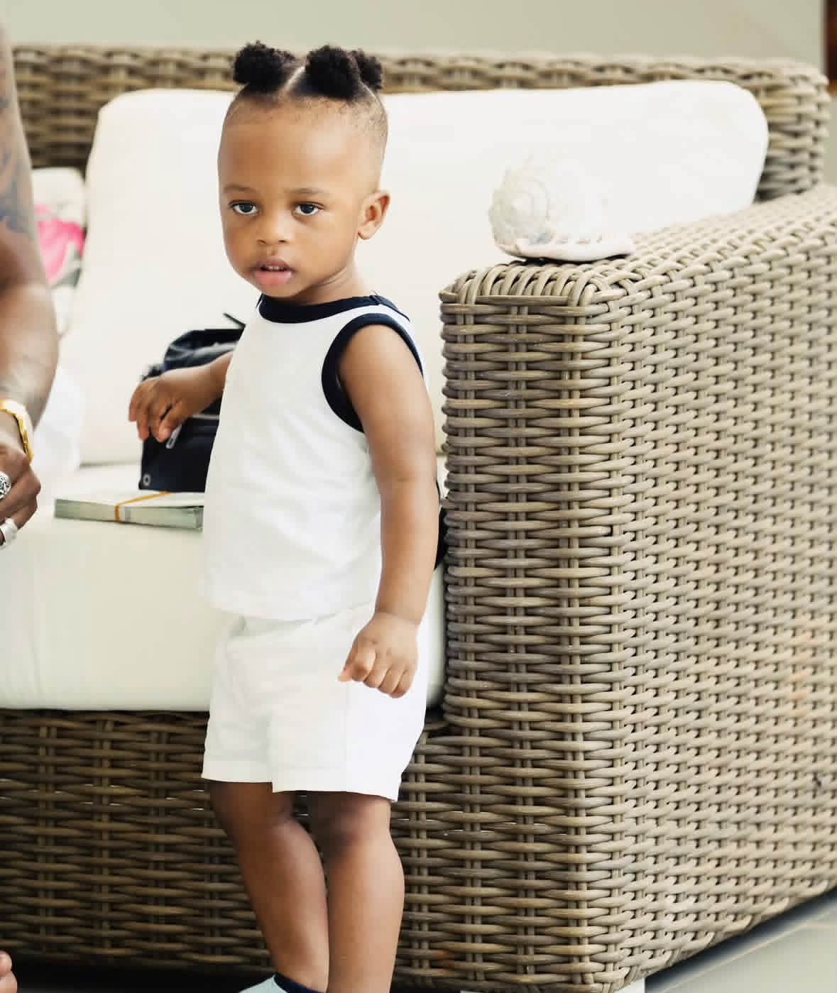 Juma Jux and his son Rakeem in matching white outfits